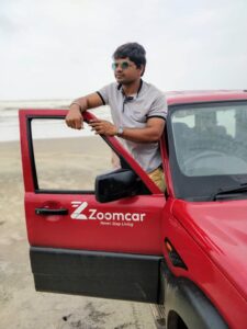 A Man With Red car Window side